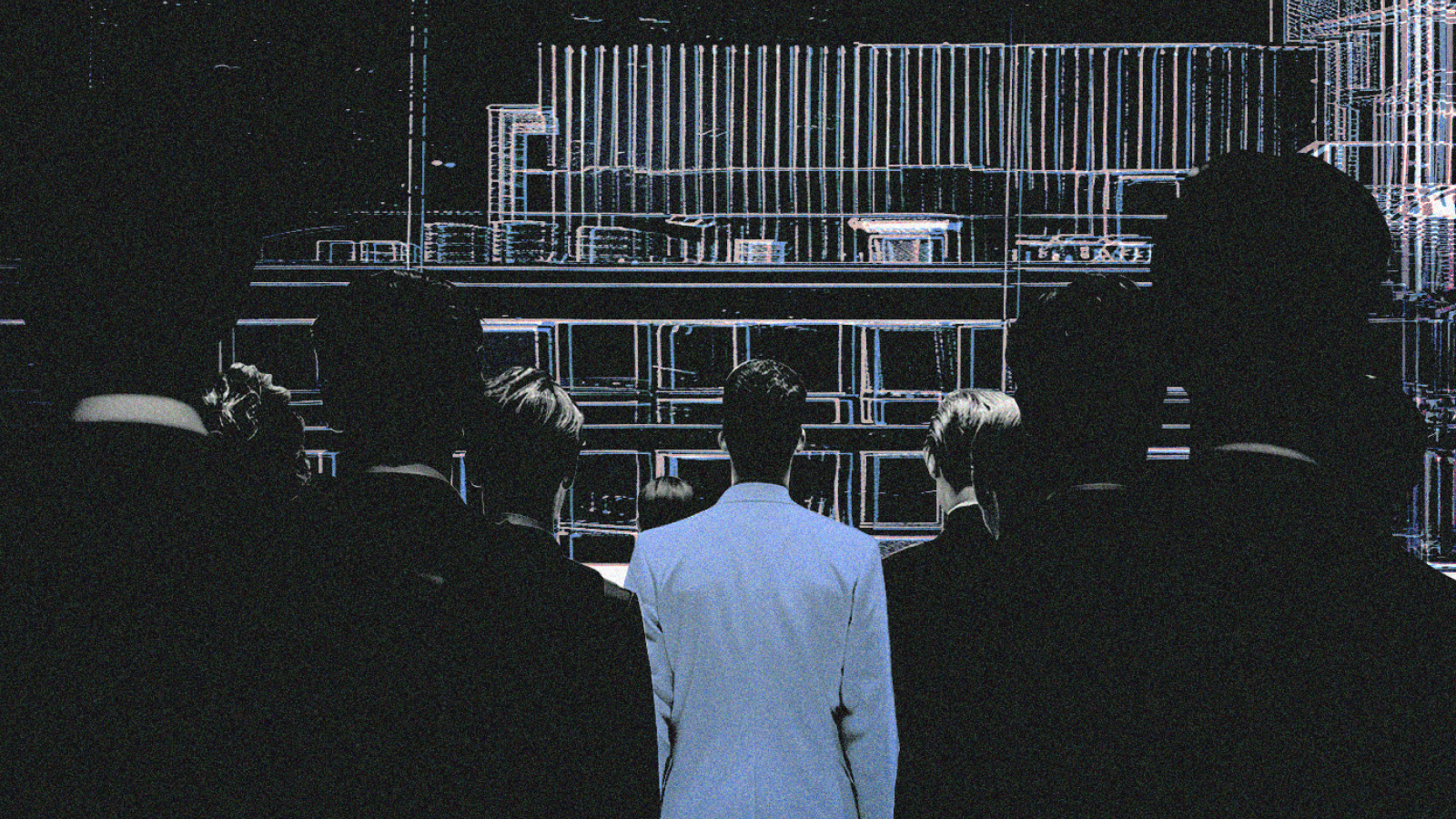 Группа людей, стоящих перед технологическим проектом, символизирующим обсуждение и стратегическое планирование стартапа