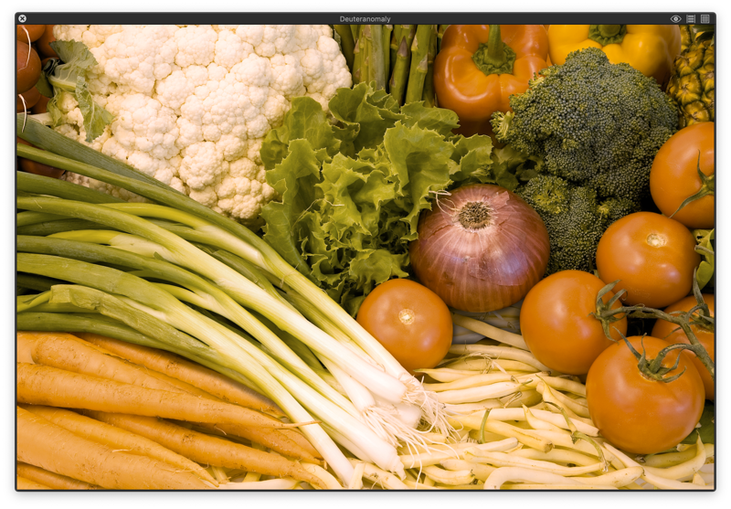Ассорти овощей, включая помидоры, перец, брокколи и фасоль, отображённое с учётом дейтераномального восприятия