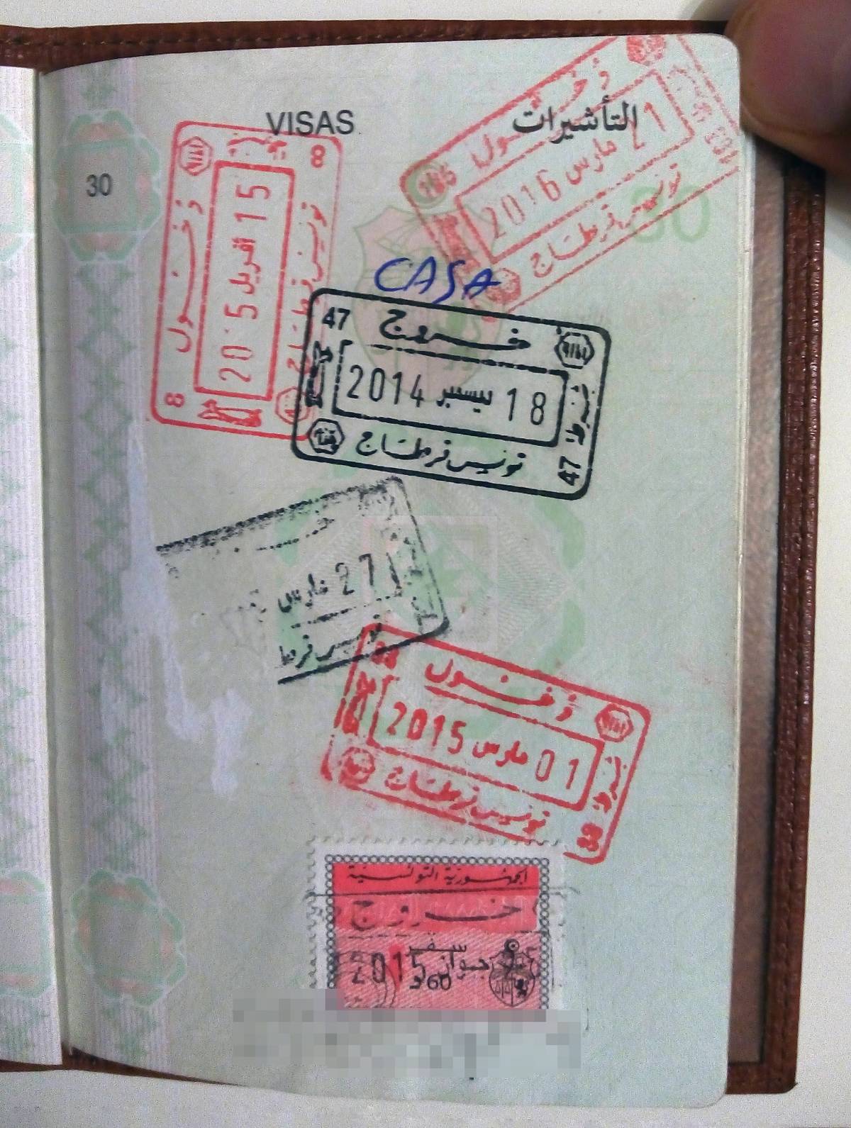 Одна из страниц из тунисского паспорта У. с отметками о пересечении границы