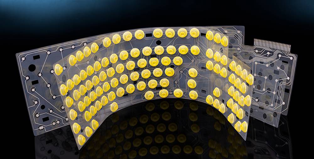 Внутри мембранная клавиатура устроена так. Верхний слой — резиновая мембрана, а нижний — плата с контактами. Источник: KPixMining / Shutterstock
