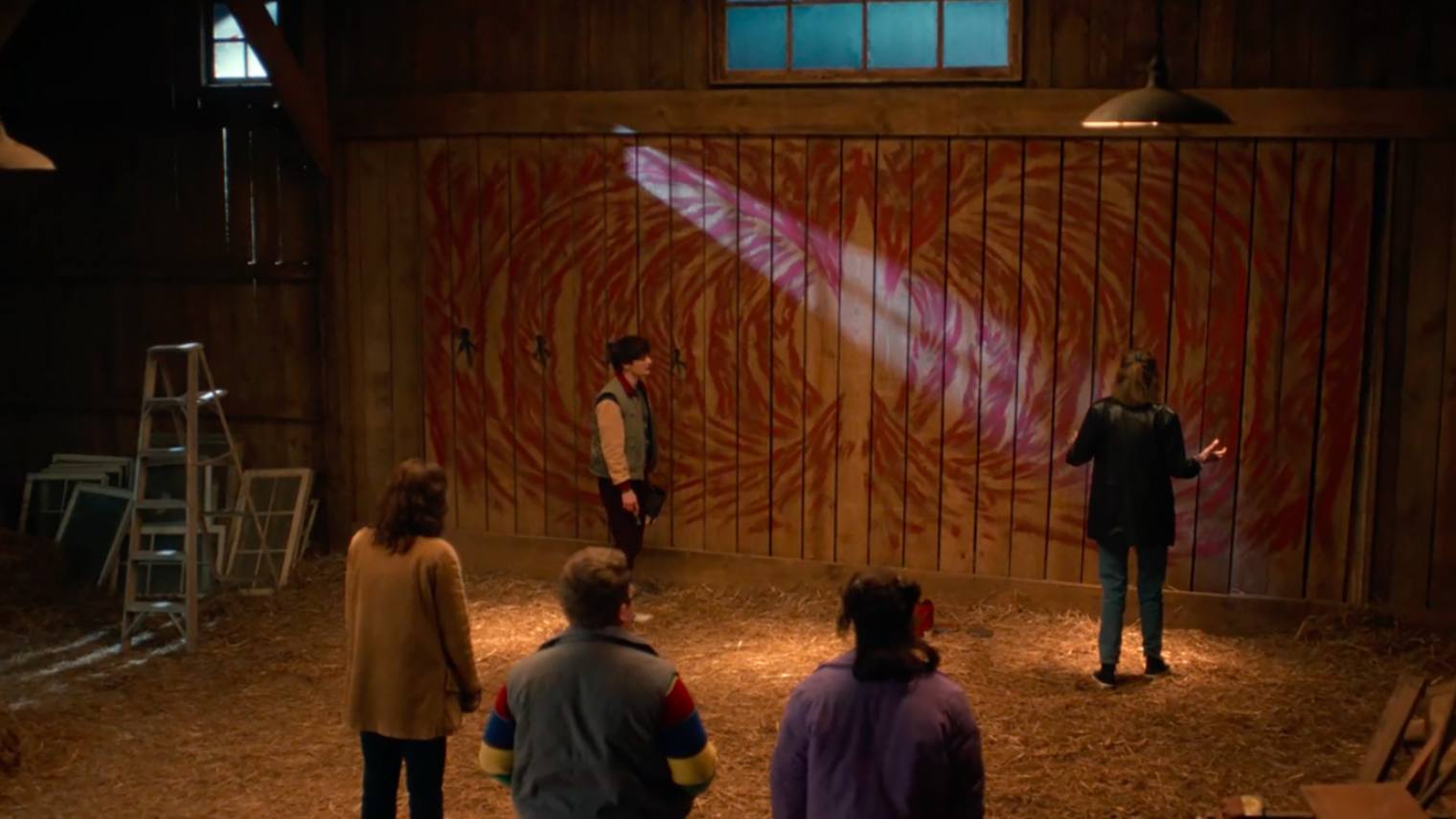 С помощью рисунка на стене амбара молодой человек пытается показать, что будет с детьми в логове Векны