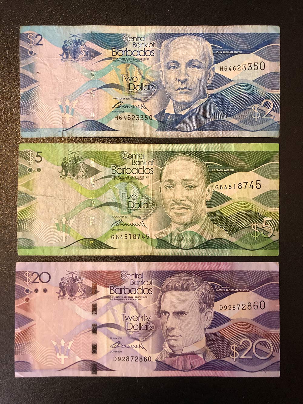 Это доллары острова Барбадос, тоже оставил их для своей коллекции